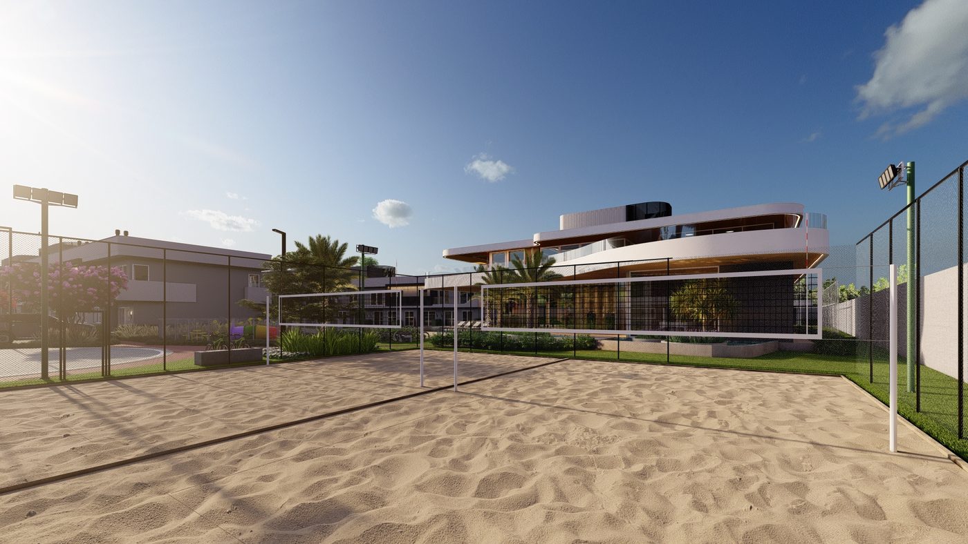 Quadra de areia para beach tennis, com o clube ao fundo