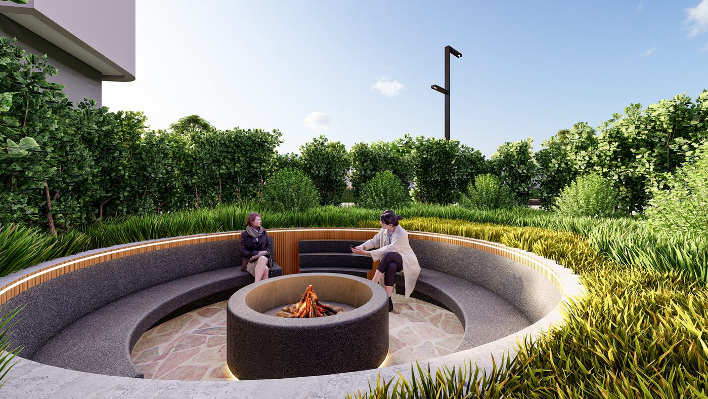 Praça rebaixada com fogueira central e banco circular, cercada de vegetação