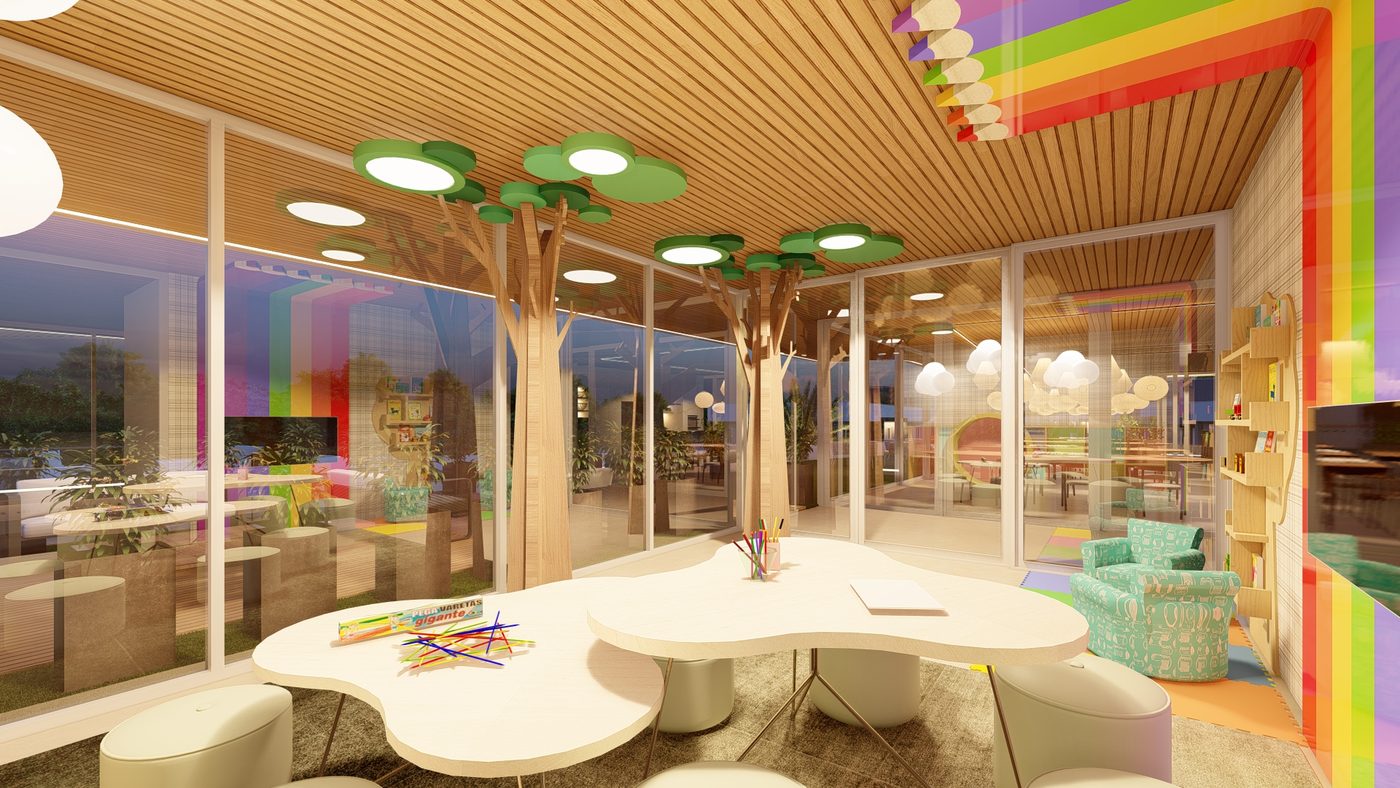 Espaço kids colorido, com mesas baixas e estante de livros