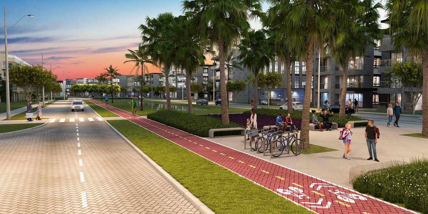 Ciclovia ao entardecer, com bicicletário e pessoas caminhando