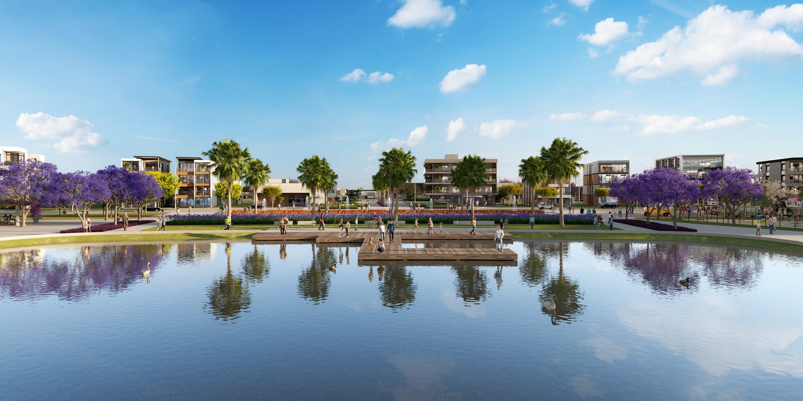 Lago da praça principal refletindo as construções e as árvores floridas