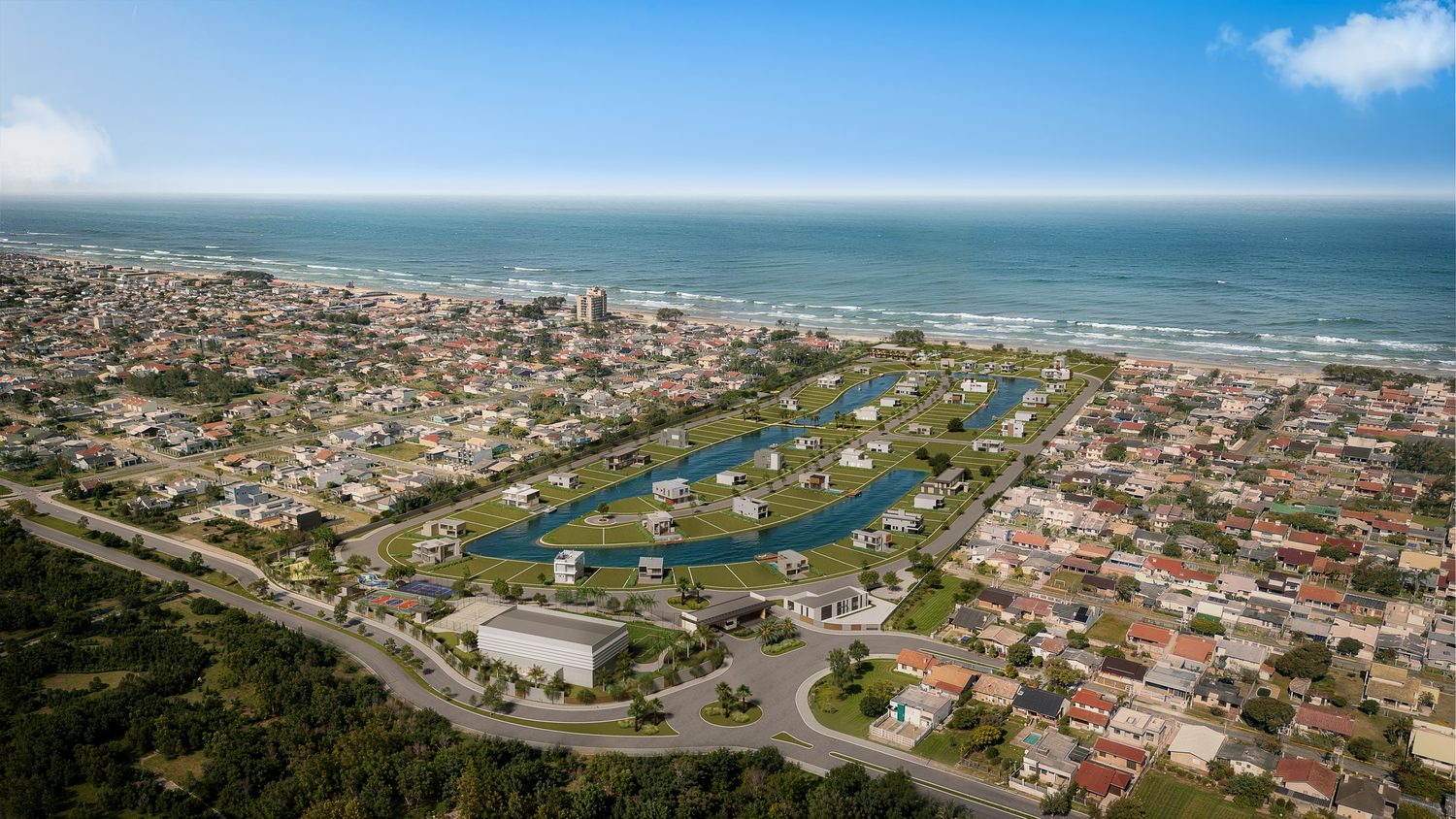 Vista aérea da região, com o mar de um lado e o bairro do outro