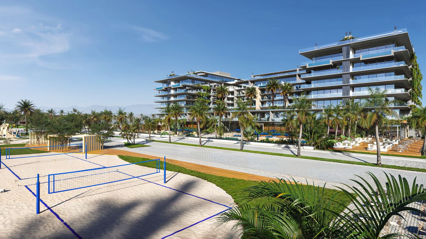 Praça em frente ao empreendimento, com quadra de beach tennis