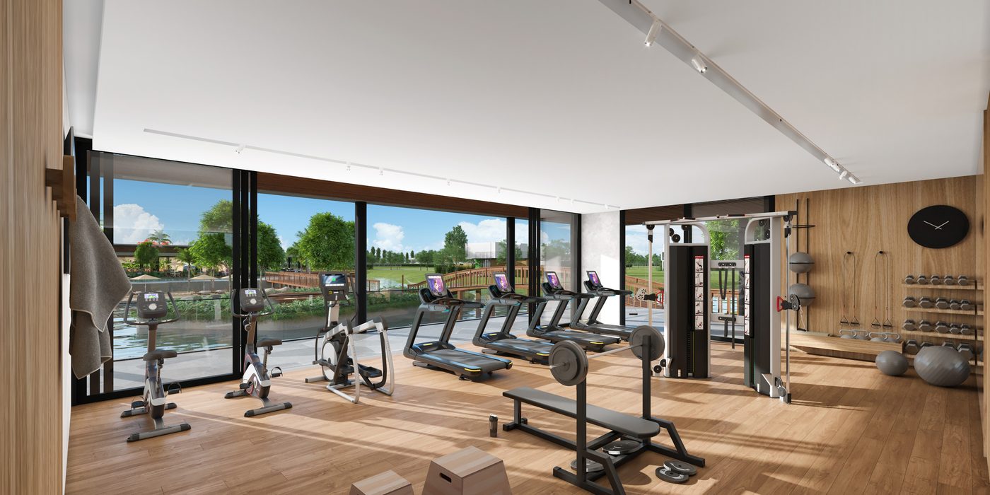 Sala de musculação envidraçada, com vista para a água