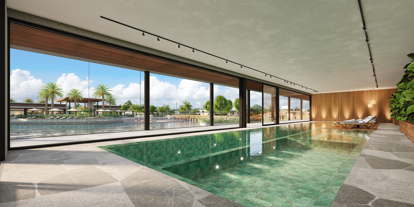 Piscina coberta e aquecida, envidraçada, com vista para o lago