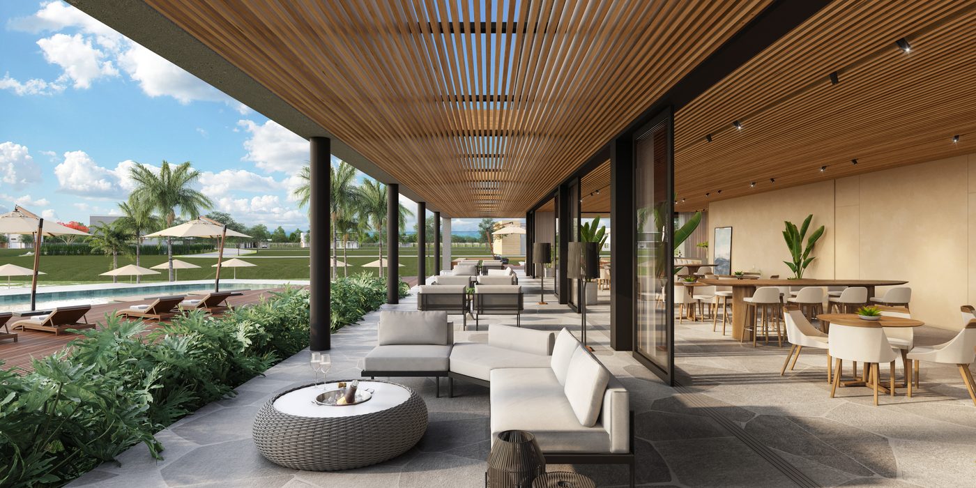 Varanda corrida do club house, com estar externo e vista para a piscina