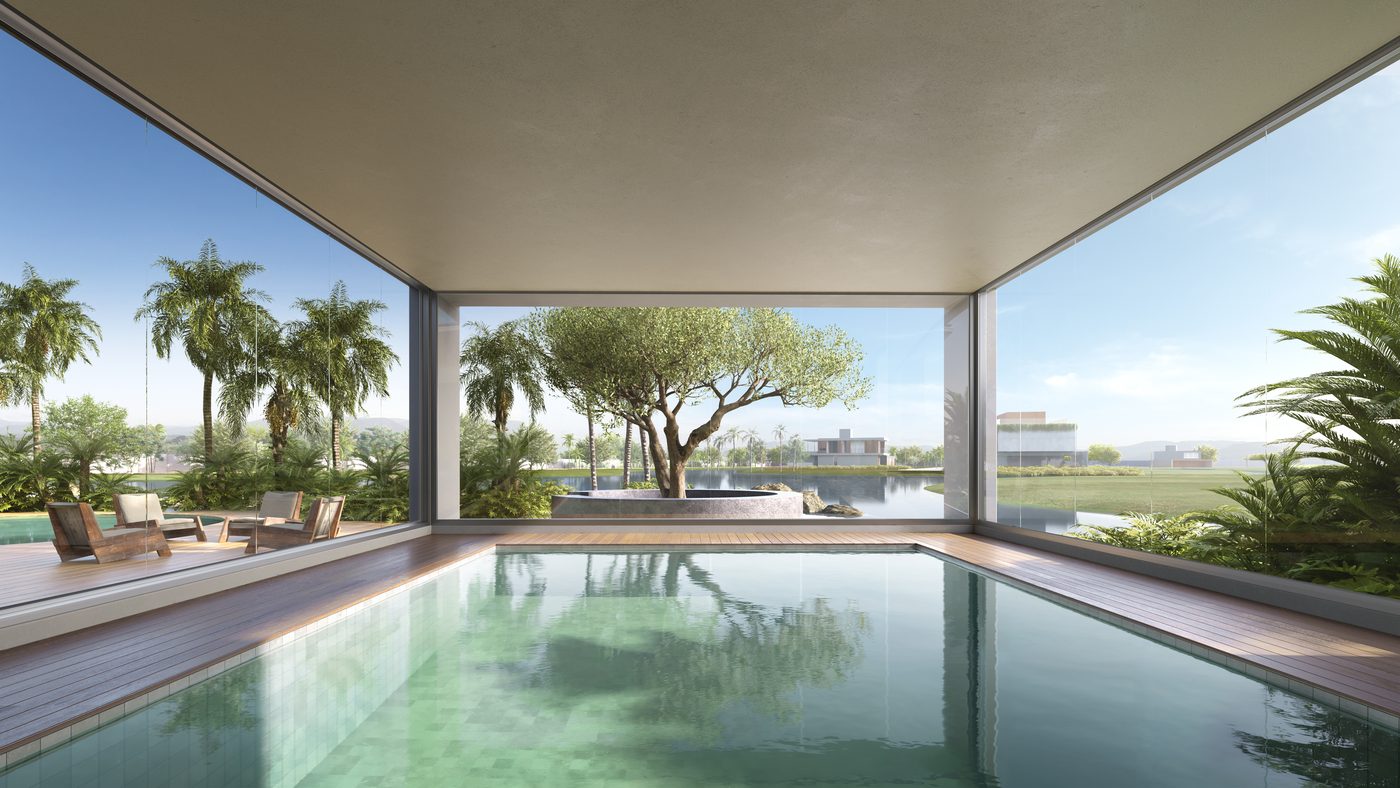 Piscina térmica coberta, envidraçada dos dois lados, com vista para o lago